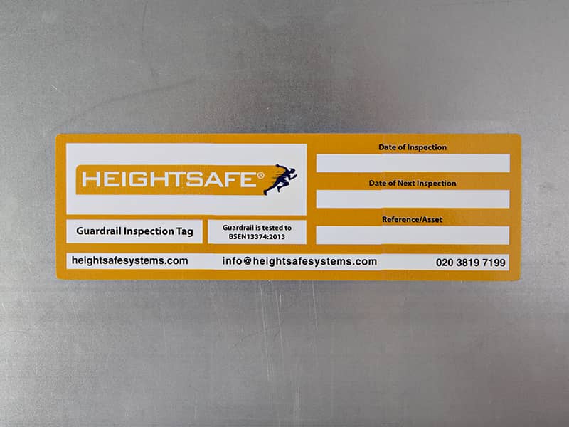 red adhesive inspection label